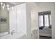 Sleek bathroom featuring double sinks, a modern vanity, and a view into the bedroom at 2147 N Downing St, Denver, CO 80205