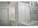 Modern bathroom with double sinks, white cabinets, and a glass-enclosed shower with stylish fixtures at 2147 N Downing St, Denver, CO 80205