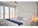 Bright bedroom features large windows, a ceiling fan, and a plush king-size bed at 2147 N Downing St, Denver, CO 80205