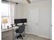 Bright bedroom with a gray desk, ergonomic chair, and natural light streaming through sheer curtains at 2147 N Downing St, Denver, CO 80205