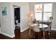 Bright dining area with round table, four chairs, side table, decor and view of a half bathroom at 2147 N Downing St, Denver, CO 80205