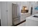 Sleek kitchen featuring stainless steel refrigerator, modern cabinetry, and elegant countertops at 2147 N Downing St, Denver, CO 80205
