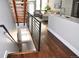 Beautiful kitchen island with staircase leading to a living room area with great natural light at 2147 N Downing St, Denver, CO 80205