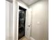 Efficient laundry closet features a stacked washer and dryer for space-saving convenience at 2147 N Downing St, Denver, CO 80205