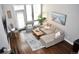 Bright living room with comfortable seating, stylish rug, and natural light with an outdoor door at 2147 N Downing St, Denver, CO 80205