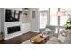 Cozy living room with fireplace, modern furniture, and an abundance of natural light at 2147 N Downing St, Denver, CO 80205