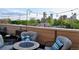 Scenic rooftop deck with comfortable seating, a fire pit, and beautiful city skyline views at 2147 N Downing St, Denver, CO 80205