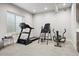 Home gym in the finished basement, featuring a treadmill, and other gym equipment with a window and carpet at 7950 Piney River Ave, Littleton, CO 80125
