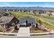 Stunning modern home with mountain views, lush landscaping, and a welcoming two-car garage at 7950 Piney River Ave, Littleton, CO 80125