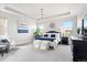 Bright main bedroom with tray ceiling, plush carpets, and ample natural light at 7950 Piney River Ave, Littleton, CO 80125