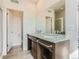 Elegant bathroom with double vanity, modern fixtures, and a glass-enclosed shower for a spa-like experience at 4628 Mt Shavano St, Brighton, CO 80601