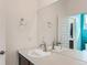 Modern bathroom with a sleek vanity, contemporary fixtures, and a large mirror, creating a bright atmosphere at 4628 Mt Shavano St, Brighton, CO 80601