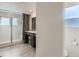 Well-appointed bathroom with a modern vanity, a walk-in shower, and a separate toilet area at 4628 Mt Shavano St, Brighton, CO 80601
