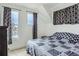 This bedroom has large windows for ample light and unique sloped ceilings at 4628 Mt Shavano St, Brighton, CO 80601