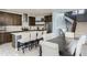 Modern kitchen with sleek stainless steel appliances, hardwood floors and a central island at 4628 Mt Shavano St, Brighton, CO 80601