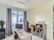 Bright office space featuring a desk, bookshelf, and lots of natural light at 4628 Mt Shavano St, Brighton, CO 80601