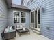 Outdoor patio area with comfortable seating and a sliding glass door for access to the indoors at 4628 Mt Shavano St, Brighton, CO 80601
