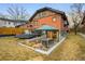 Backyard of brick home with outdoor sunken living and dining area at 1453 S Lafayette St, Denver, CO 80210