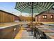 Backyard view showcasing outdoor dining space, patio, and landscaping at 1453 S Lafayette St, Denver, CO 80210