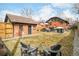 Expansive backyard with a detached garage, patio, seating area, and ample green space, perfect for outdoor activities at 1453 S Lafayette St, Denver, CO 80210