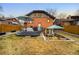 A beautiful backyard with a deck and sunken patio with seating at 1453 S Lafayette St, Denver, CO 80210
