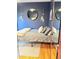 Cozy bedroom featuring a round mirror, stylish sconces, and cool-toned walls at 1453 S Lafayette St, Denver, CO 80210