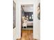 Inviting bedroom features hardwood floors, natural light, a comfortable bed, and stylish modern decor at 1453 S Lafayette St, Denver, CO 80210