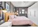 Stylish bedroom features gray walls, a statement headboard, modern lighting, and ample storage at 1453 S Lafayette St, Denver, CO 80210