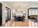 Bright dining room with ample natural light, hardwood floors, and a view to the living room at 1453 S Lafayette St, Denver, CO 80210