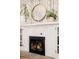 Close-up of the fireplace area with a decorative mirror and mantelpiece decor at 1453 S Lafayette St, Denver, CO 80210