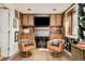 Cozy living room featuring fireplace, custom built-ins, and charming wallpaper accents at 1453 S Lafayette St, Denver, CO 80210