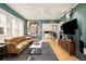 Comfortable living room with a leather sofa, modern decor, and hardwood floors at 1453 S Lafayette St, Denver, CO 80210
