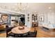 Open-concept living area with stylish furniture, a modern chandelier, and decor at 1453 S Lafayette St, Denver, CO 80210