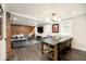 Spacious living area showcases a modern dining table and adjacent sitting area with brick accents at 1453 S Lafayette St, Denver, CO 80210
