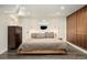 Serene bedroom with neutral tones, modern lighting, and sleek built-in storage at 1453 S Lafayette St, Denver, CO 80210