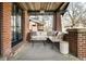 Inviting front porch featuring comfortable seating and stylish decor elements at 1453 S Lafayette St, Denver, CO 80210