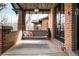 Relaxing front porch with a swing, perfect for enjoying the outdoors at 1453 S Lafayette St, Denver, CO 80210