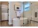 Bathroom featuring a soaking tub, glass-enclosed shower, and walk-in closet at 2962 Newfound Lake Rd, Berthoud, CO 80513