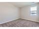 A bright bedroom features neutral walls and plush carpet at 2962 Newfound Lake Rd, Berthoud, CO 80513