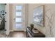 Welcoming entryway with a console table, art, a modern light fixture, and a view into the home at 2962 Newfound Lake Rd, Berthoud, CO 80513