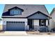 Two-story Craftsman home with gray siding, white accents, and a two-car garage at 2962 Newfound Lake Rd, Berthoud, CO 80513