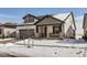 Charming two-story home with stone accents, gray trim, a two-car garage, and snow-covered front yard at 2962 Newfound Lake Rd, Berthoud, CO 80513