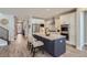 Modern kitchen with stainless steel appliances, a center island, white cabinetry, and eat in kitchen area at 2962 Newfound Lake Rd, Berthoud, CO 80513