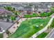 Aerial view of a property with a fenced backyard featuring a deck, pergola, and a well-maintained lawn at 6470 Amur Ct, Castle Rock, CO 80108