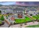 Aerial view of a home with a large backyard featuring a deck, pergola, and manicured lawn at 6470 Amur Ct, Castle Rock, CO 80108