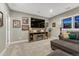 Finished basement with media center, comfortable seating, and warm lighting at 6470 Amur Ct, Castle Rock, CO 80108