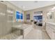 A modern bathroom featuring a glass shower, soaking tub, and double vanity at 6470 Amur Ct, Castle Rock, CO 80108