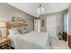 A comfortable bedroom featuring a neutral color palette and a large window at 6470 Amur Ct, Castle Rock, CO 80108