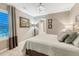A comfortable bedroom featuring a neutral color palette and a large window at 6470 Amur Ct, Castle Rock, CO 80108