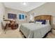 Cozy bedroom with neutral walls, a drumset and a comfortable king bed at 6470 Amur Ct, Castle Rock, CO 80108
